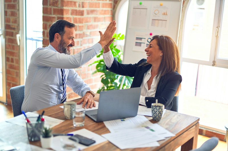 Advisers meeting with a client